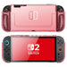 Front and rear views of the Mumba Blade Clear Pink case for Nintendo Switch 2, showing the translucent shell and rounded grips.